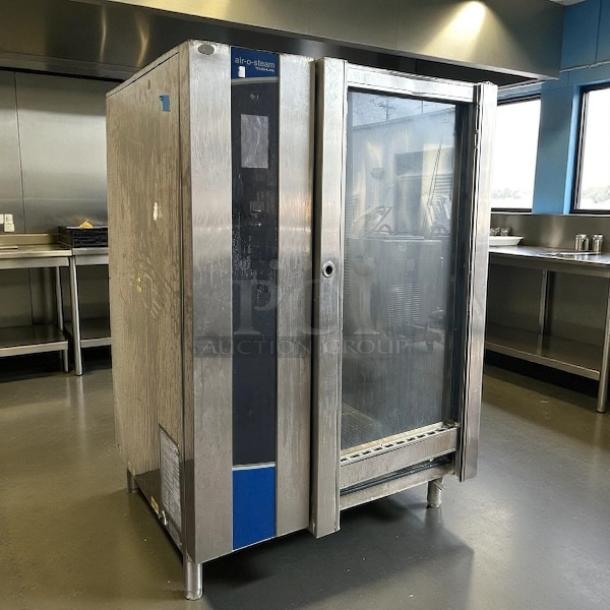 Electrolux Air-o-Steam Touchline AOS202GTP1 natural-gas combi oven in working condition, stainless steel exterior, glass door.