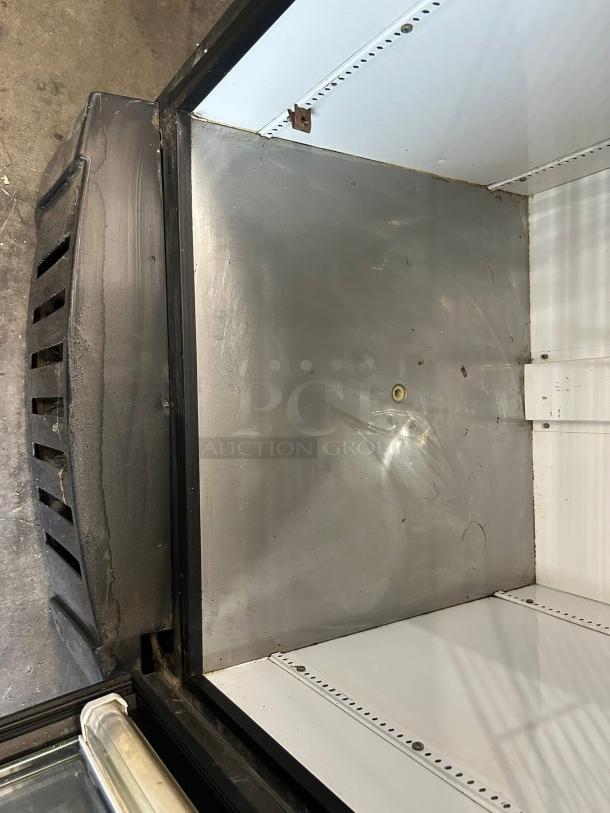 True GDM-26-HC~TSL01 glass door merchandiser, interior view, one section, excellent condition, 115v, tested working.