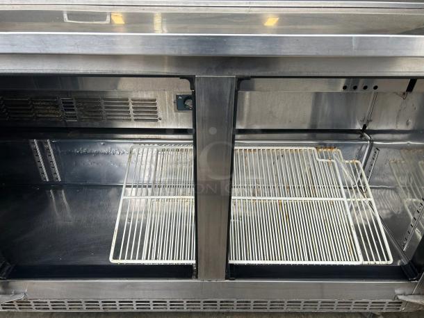 Everest EPBNR3 sandwich/salad prep table, stainless steel, refrigerated base, shelving visible, tested and working.