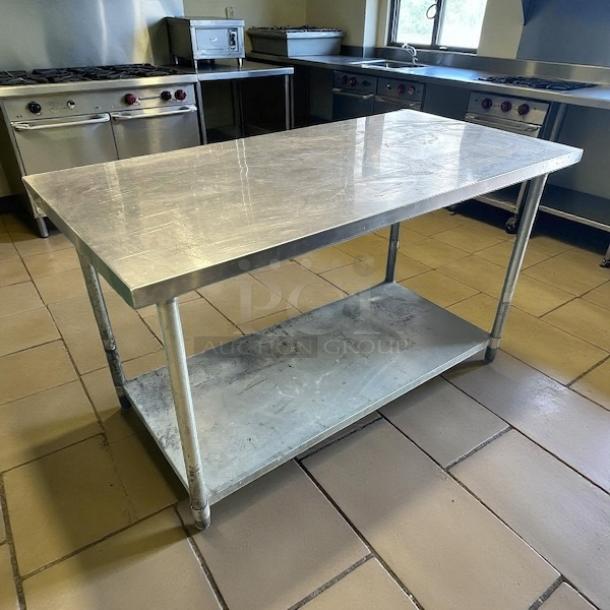 GSW USA WT-P3060 stainless steel work table, 30"x60", excellent condition, smooth surface, with lower shelf, in kitchen setting.