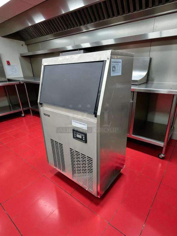 VEVOR ice maker, model ZBJ50KGSYP70-5001V1, produces 110 lbs/day. Stainless steel, front panel display, tested working.