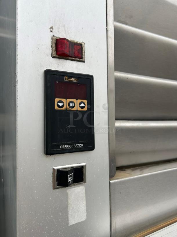 Traulsen G11010 refrigerator panel with digital controls and red indicator light, in tested working condition.