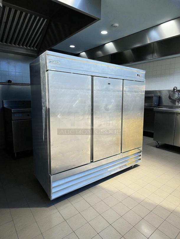Kintera KBM3R 3-door reach-in refrigerator in great condition, bottom mount. Tested and working, industrial kitchen setting.