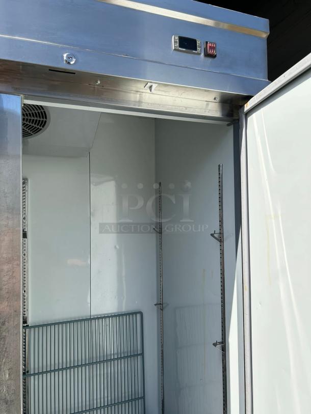 Kintera KBM3R 3-door reach-in refrigerator in great condition, features a bottom mount and digital display, tested and working.