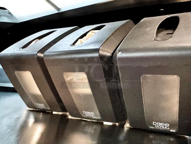 Three Dixie Ultra napkin dispensers, compact countertop model, in great condition, each 7.5"x5.86"x7.2", branded Georgia-Pacific.