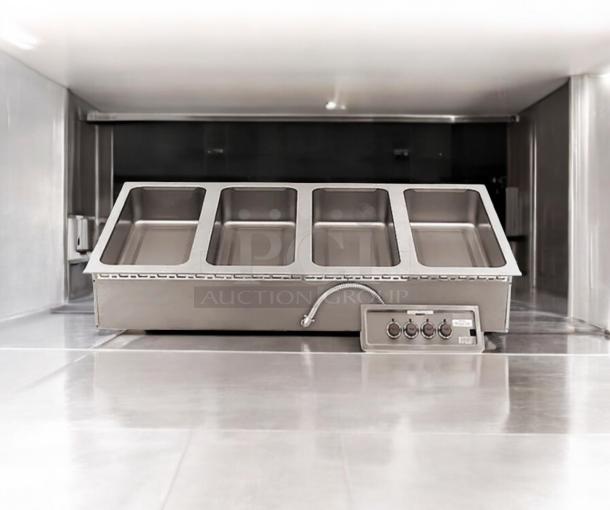 Brand new APW Wyott HFW-4D 4-well hot food table, electric 208/240V, sealed in original packaging, stainless steel.