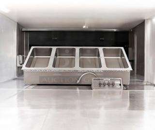 Brand new APW Wyott HFW-4D 4-well hot food table, electric 208/240V, sealed in original packaging, stainless steel.