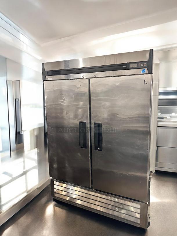 Turbo Air R49-S reach-in refrigerator with two solid doors, 115V, in excellent condition. Features durable stainless steel finish.