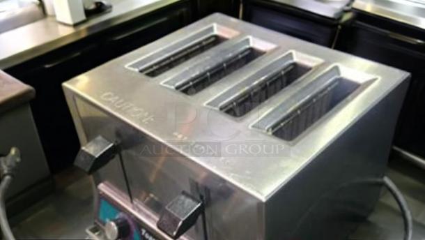 Toastmaster TP409 commercial 4-slot toaster in excellent condition, stainless steel finish, fully tested, 120V, "Caution" marked.