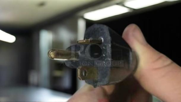 Close-up of a power plug for a Toastmaster TP409 4-slot pop-up toaster, 120V, showcasing its excellent condition.