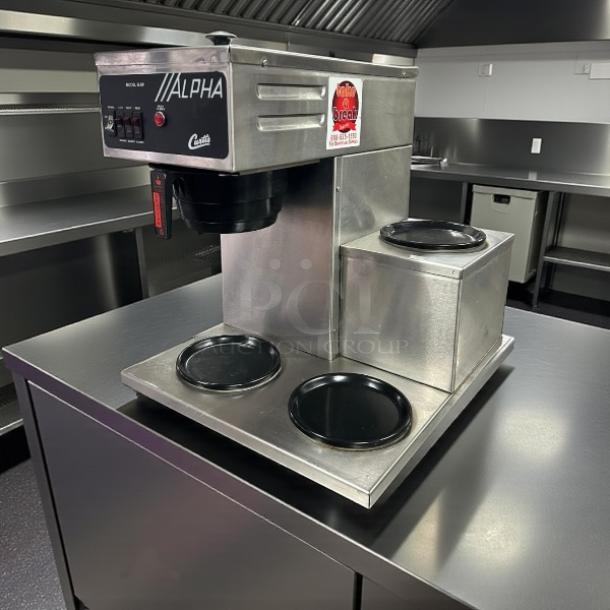 Curtis ALPHAIII-SP-10 coffee brewer, great condition, 12-cup capacity, three lower warmers left, 120/220V, tested and working.