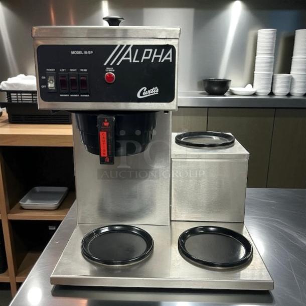 Curtis ALPHAIII-SP-10 coffee brewer, 12-cup capacity, 3 lower warmers, great condition, 120/220V, tested and working.