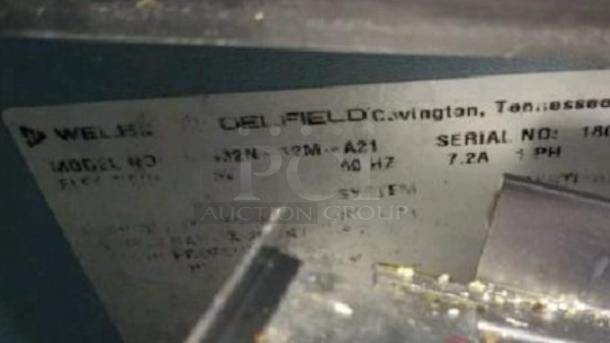 Delfield 4400EL-N12M-A21 tag showing model, serial number, 115V, 60Hz, tested and working condition.