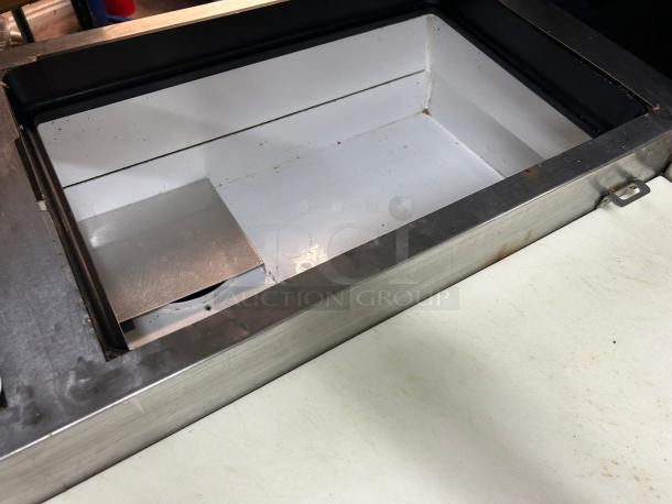 True TPP-AT2-93-HC refrigerated pizza prep table with overshelf, showing interior compartment, tested and working.