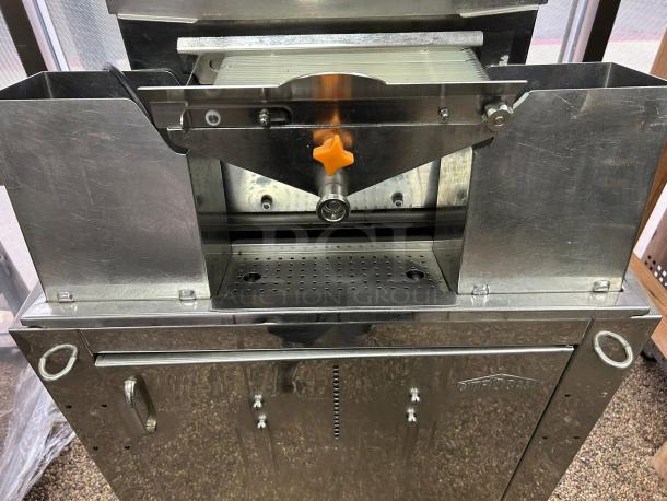 Citrocasa 8000 SB-ATS Advance Citrus Juicer in excellent condition, visible steel body, orange spout, and branded markings.