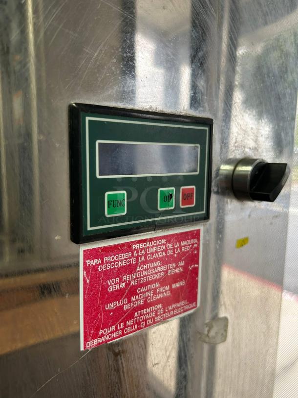 Citrocasa 8000 SB-ATS citrus juicer, stainless steel, excellent condition, red caution label advises unplugging for cleaning.