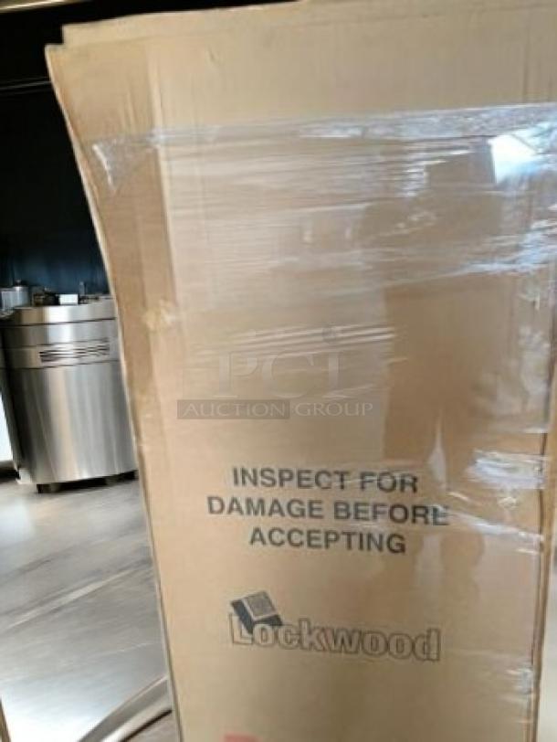 Brand new Lockwood CA72-RR12-6-2625-L aluminum sheet pan rack, 12 pan capacity, in original packaging with inspection notice.