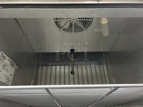 True T-23F-HC 27" solid door reach-in freezer, excellent condition, interior view, model label visible.