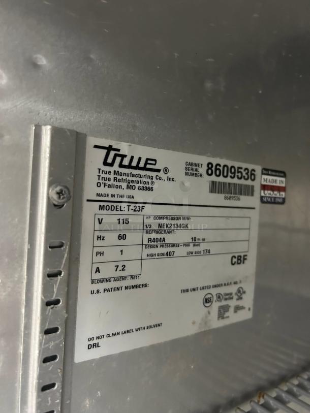 True T-23F-HC freezer label showing model, voltage, refrigerant, and other specs. Made in the USA.