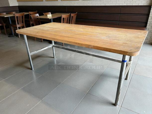 John Boos butcher block worktable with open base, great condition, wooden top, metal legs. Suitable for kitchen or workspace.