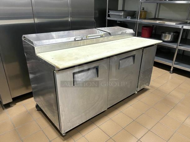True TPP-AT-67-HC 67" refrigerated pizza prep table, stainless steel, two doors, tested and working condition.