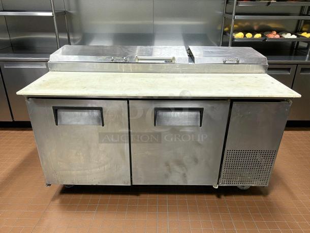 True TPP-AT-67-HC 67" refrigerated pizza prep table, stainless steel, two doors, tested and working condition.