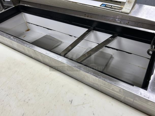 True TPP-AT-67-HC 67" 2-door pizza prep table, stainless steel, tested, working. Interior detail shows capacity and condition.