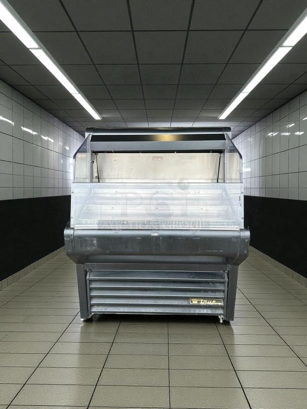 True THAC-36-HC-LD 36" Open Air Refrigerated Merchandiser, tested and working, silver finish, visible True logo.
