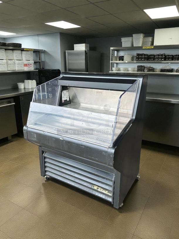 True THAC-36-HC-LD 36" open air curtain refrigerated merchandiser, tested and working, excellent condition, visible True logo.