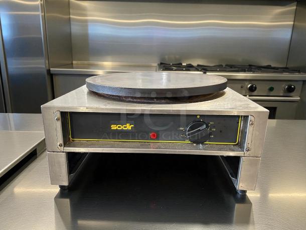 Equipex 400E electric crepe machine, excellent condition, features 15-3/4” cast iron plate, temperature dial, brand label "sodir".