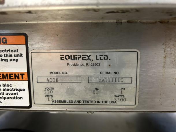 Alt text: Equipex 400E crepe machine label showing model, serial number, voltage, and wattage details.