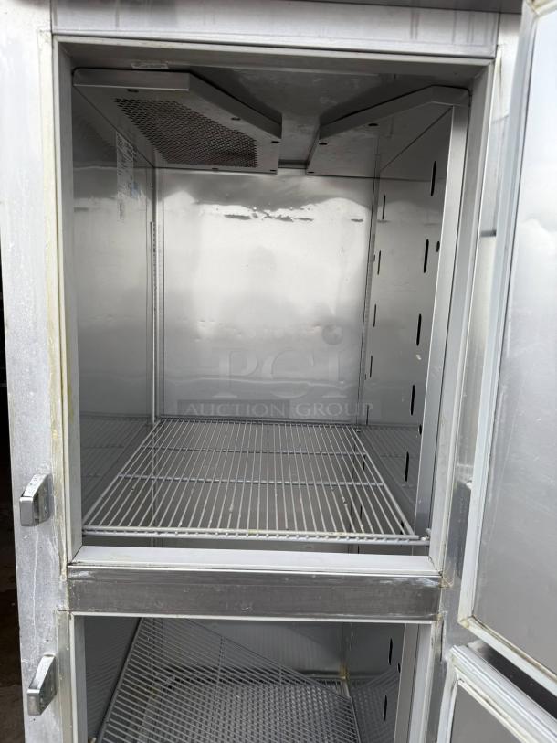 True STG1R-2HS-HC reach-in refrigerator, 27.5", two right-hinge solid doors, shelves visible, tested and working.