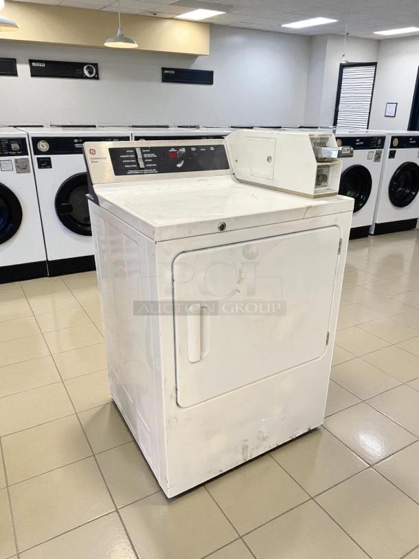 GE DCCD330EDWC 7.0 Cu. Ft. coin-operated electric dryer, excellent condition, tested and working, white finish.