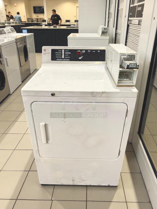 GE DCCD330EDWC 7.0 Cu. Ft. coin-operated electric dryer in excellent condition, tested and working, with $1.00 coin slot.