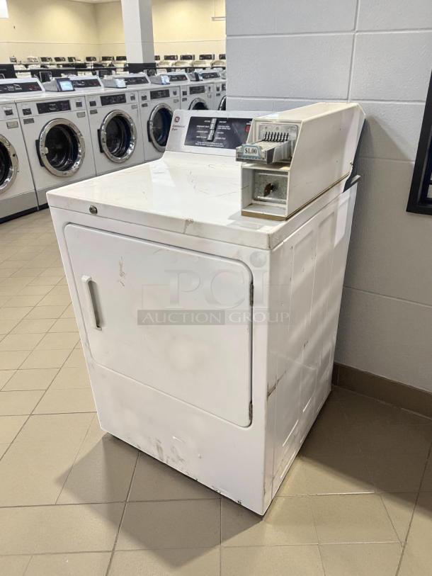 GE DCCD330EDWC 7.0 Cu. Ft. Coin-Operated Electric Dryer in excellent condition, tested working, visible $1.00 coin slot.