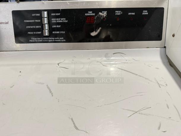 GE DCCD330EDWC 7.0 Cu. Ft. coin-operated dryer in excellent condition, tested and working. Control panel with cycle options.