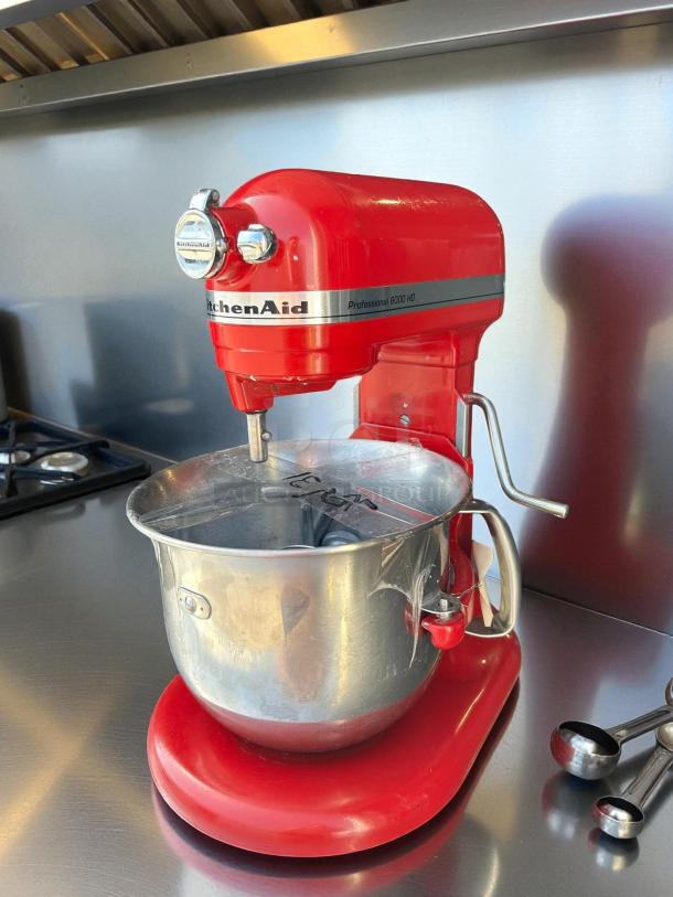 Red KitchenAid Professional 6000HD Artisan Series Tilt-Head Stand Mixer, tested, working, with stainless steel bowl.