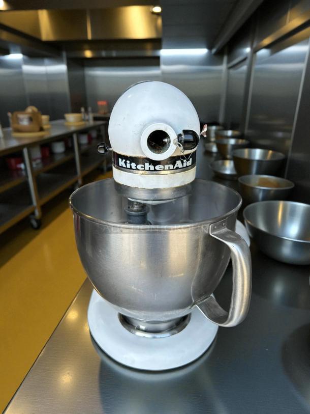 KitchenAid KSM75WH1 Classic Plus 4.5 Qt Tilt-Head Stand Mixer in white, tested and working, showing some wear marks.