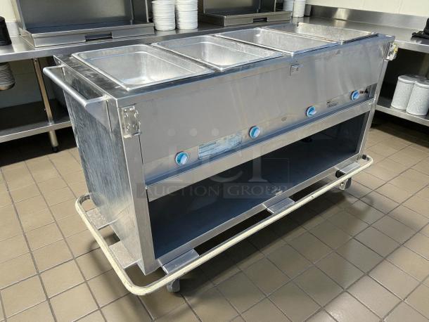 Duke E304 Aerohot electric 4-well steamtable, great condition, 208V, tested working, stainless steel with control knobs.