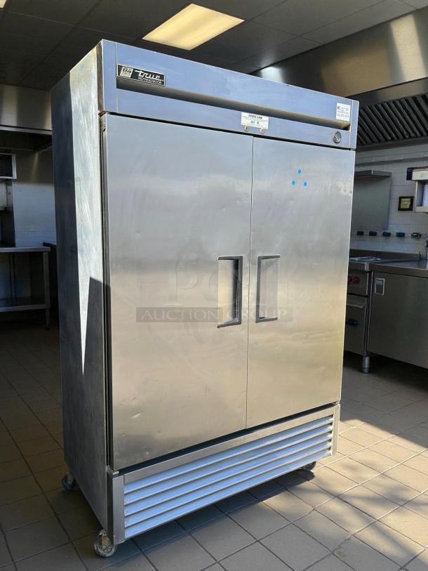 True TS-49-HC 54" stainless steel reach-in refrigerator in excellent condition, tested, working, solid double doors.