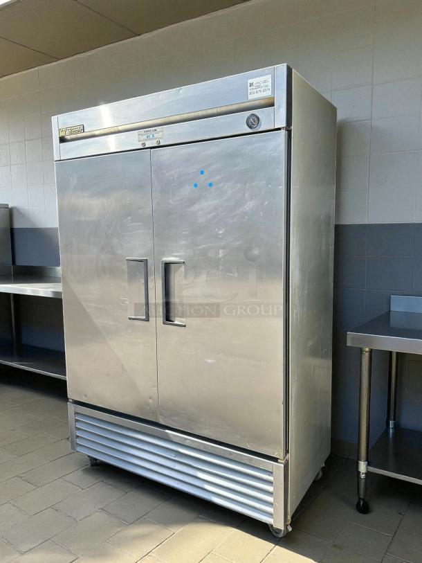True TS-49-HC stainless steel refrigerator, 54 1/8" reach-in, solid doors, excellent condition, tested and working.