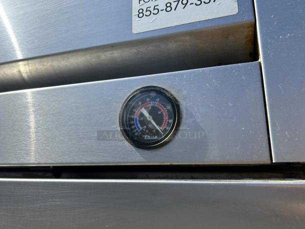 True TS-49-HC stainless steel reach-in refrigerator in excellent condition. Features visible thermometer and serial label.