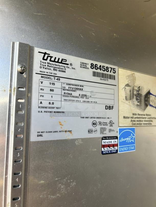 True TS-49-HC refrigerator label showing model, specs, and energy ratings. Made in USA, 54 1/8" stainless steel, excellent condition.