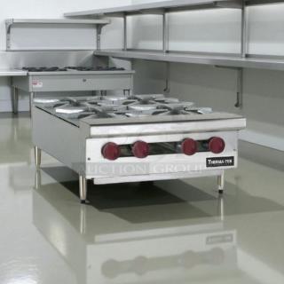 Brand new Therma-Tek TCHP24-4-NG 24" natural gas countertop hot plate with four open burners, stainless steel finish.