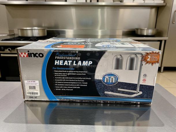 Winco EHL-2C heat lamp in original packaging, freestanding, includes 2 bulbs, ETL listed, 120V, for restaurant use.