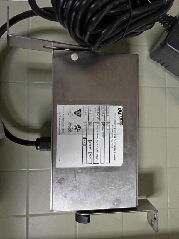 Prince Castle 740-T4 timer with alarm in excellent condition, 120v. Robust metal casing, visible label with function details.