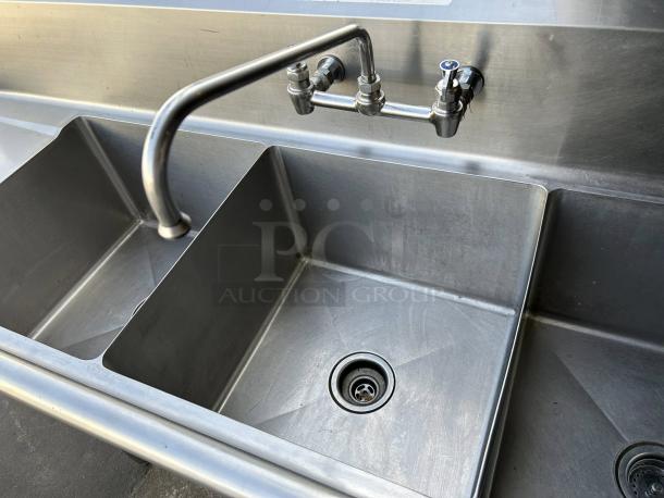 All Strong 90” 3 compartment sink in great condition, 18” x 18” basins, durable stainless steel, wall-mounted faucet.