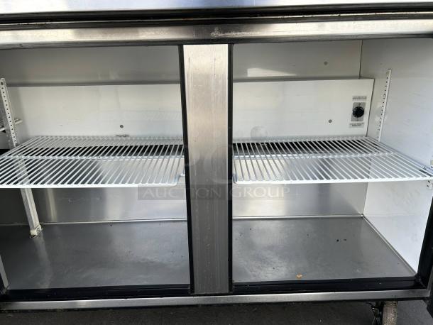 True TSSU-72-18-HC refrigerated sandwich prep table in excellent condition, 72 3/8", 3-door, stainless steel interior.