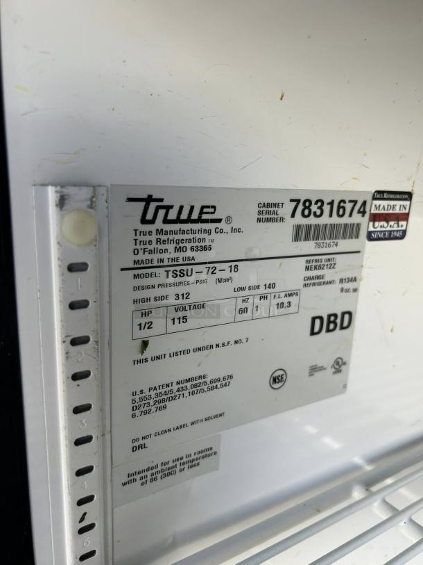 True TSSU-72-18-HC prep table label; shows model, serial number 7831674, voltage 115, made in USA, NSF certified.