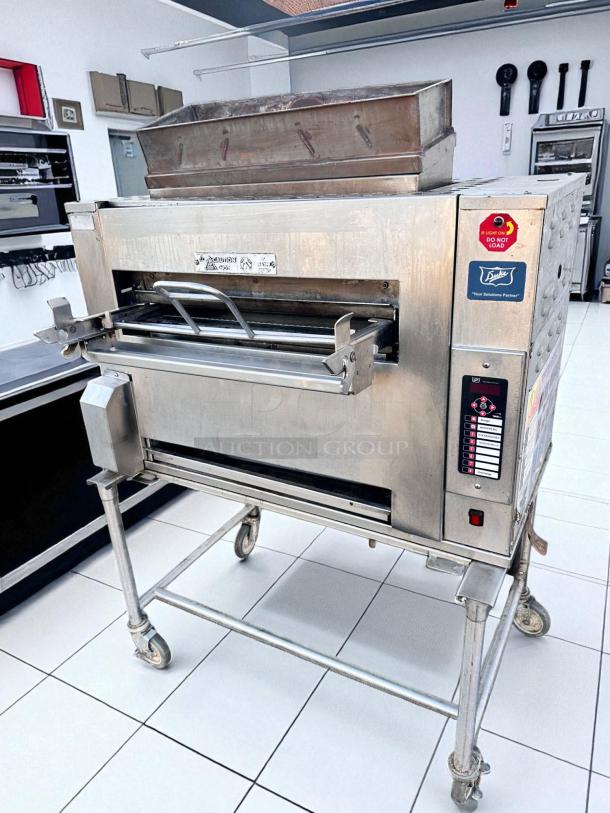 Duke FBB-NC-120 gas conveyor toaster oven, excellent condition, 43"W x 30"D x 53"H, natural gas, 120V, on wheeled stand.